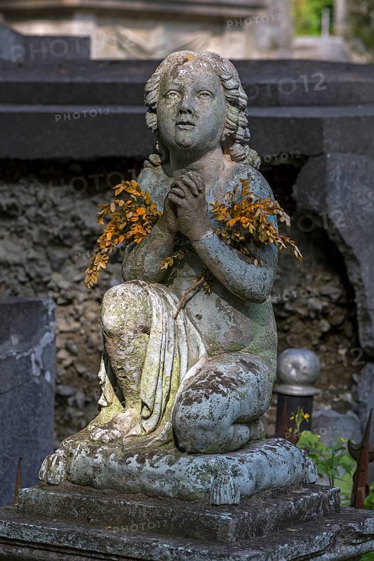 Praying sculpture at Lützenhofer cemetery Lychakivsky cemetery, Lviv, Galicia, Ukraine
