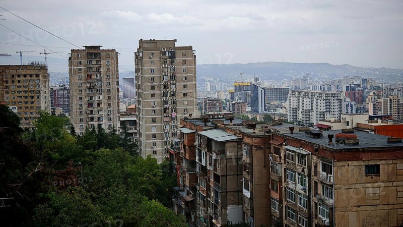 Urban panorama with high-rise buildings in a residential district of Tbilisi and hilly landscape, Tbilisi, Georgia