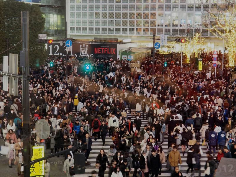 Heavy foot traffic at an urban intersection at night, Shibuya, Tokyo, Japan