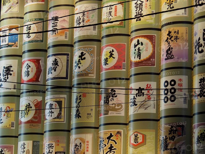 Tall stacks of decorative rice barrels with Japanese characters, Nagano, Japan