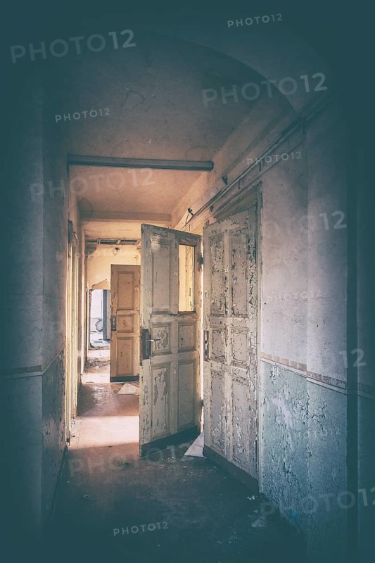 Corridor of an abandoned administration building in the light of the evening sun, Lost Place, Saxony-Anhalt, Germany