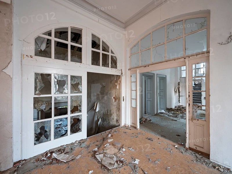 Staircase of an abandoned administration building full of rubble and shards, Lost Place, Saxony-Anhalt, Germany