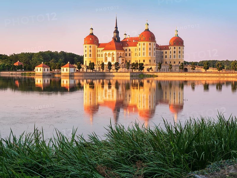 Moritzburg Castle, Augusts the Strong hunting lodge in the evening light, water reflection in the lake, Saxony, Germany