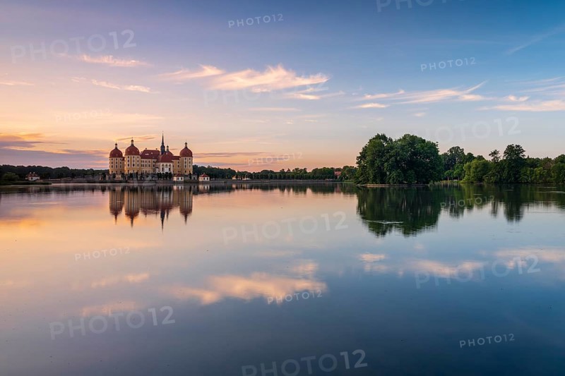 Moritzburg Castle, Augusts the Strong hunting lodge at dawn, water reflection in the lake, Saxony, Germany