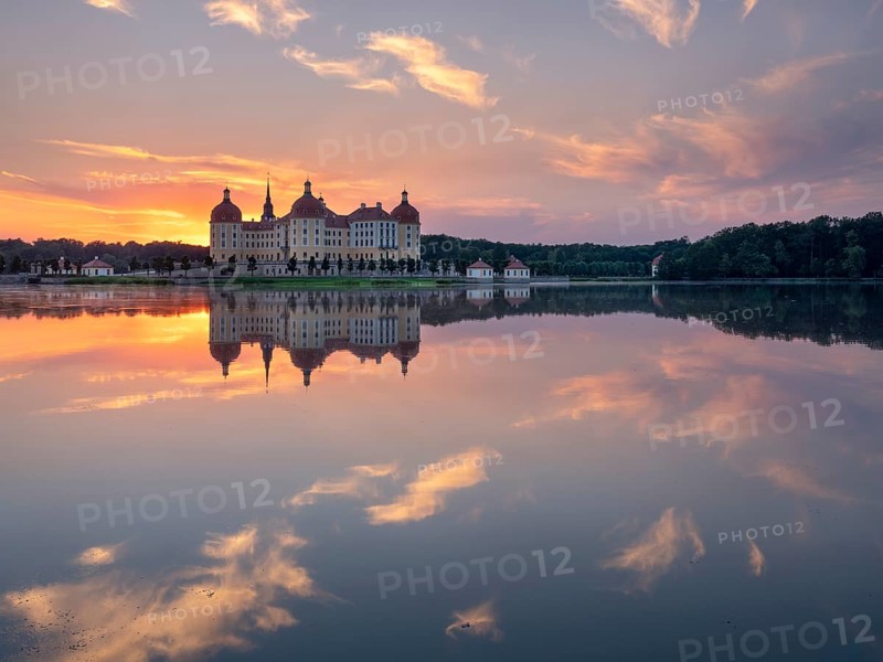 Moritzburg Castle, Augusts the Strong hunting lodge at sunset, water reflection in the lake, Saxony, Germany