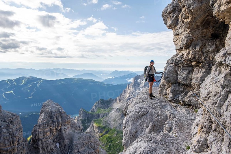 Climbers on a rock band, Bocchette Centrale band trail, via ferrata in the Brenta Mountains, Scharte Bocca di Tuckett, Parco Naturale Brenta-Adamello, Trentino, Italy