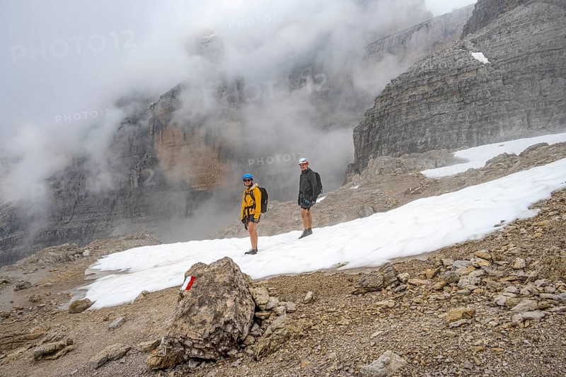 Mountaineers in a snowfield in fog, Brenta Mountains, Parco Naturale Brenta-Adamello, Trentino, Italy