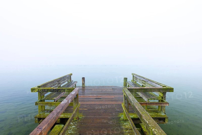 Wooden jetty at Lake Ratzeburg, Ratzeburger See in the mist, Lauenburg Lakes Nature Park, Naturpark Lauenburgische Seen, Schleswig-Holstein, Germany