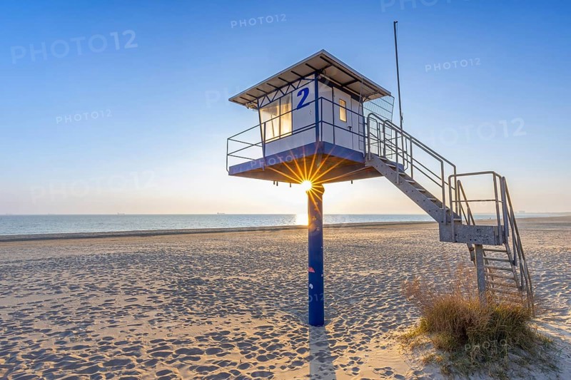 Lifeguard tower on sandy beach at seaside resort Ahlbeck along the Baltic Sea coast at sunrise on Usedom island, Mecklenburg-Vorpommern, Germany