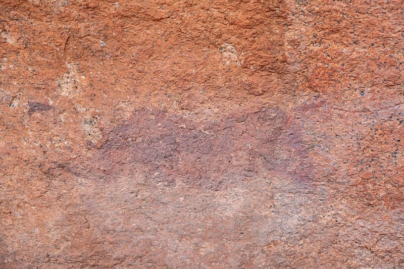 Prehistoric rock art on a red rock wall, Spitzkoppe, Namibia