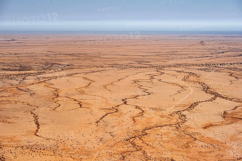 Aerial view of a dry desert with clearly structured landscapes, Spitzkoppe, Namibia