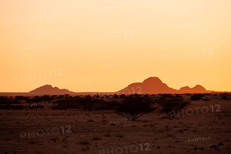 Silhouette of mountains with sunset sky in the lonely desert of Spitzkoppe, Spitzkoppe, Namibia