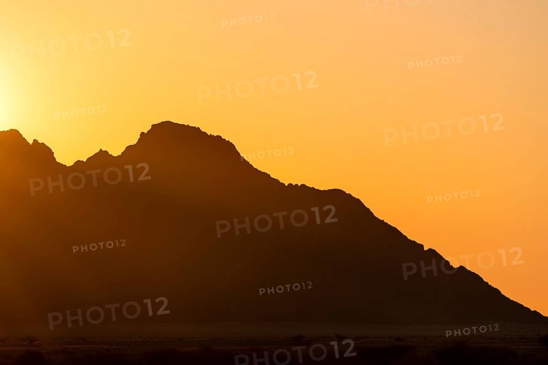 Rugged mountain silhouette at dusk, Spitzkoppe, Namibia