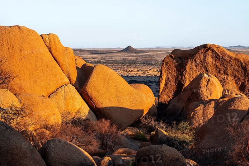 Impressive granite rocks in the barren Spitzkoppe desert with warm evening light, Spitzkoppe, Namibia
