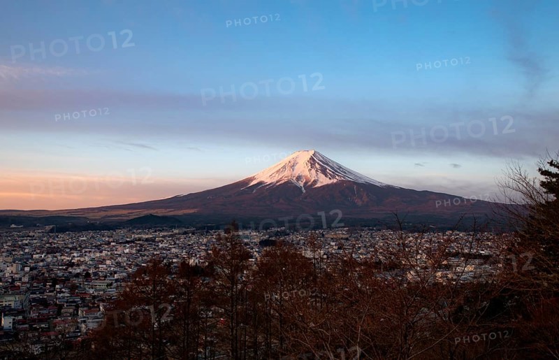 View of Mount Fuji volcano over Fujiyoshida City, at sunrise, Arakurayama Sengen Park, Yamanashi Prefecture, Japan