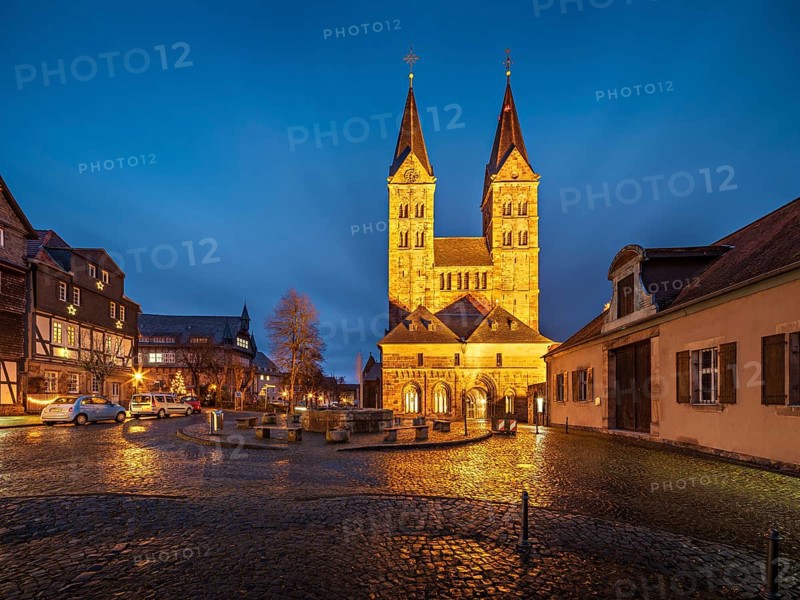 The cathedral in the historic old town in the evening, cathedral square with cobblestones, Fritzlar, Hesse, Germany
