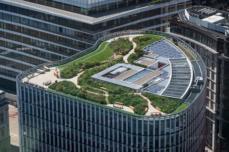 Modern building with green roof and solar panels seen from Sky Gardens, Upper Thames Street and Arthur Street, London, England, Great Britain