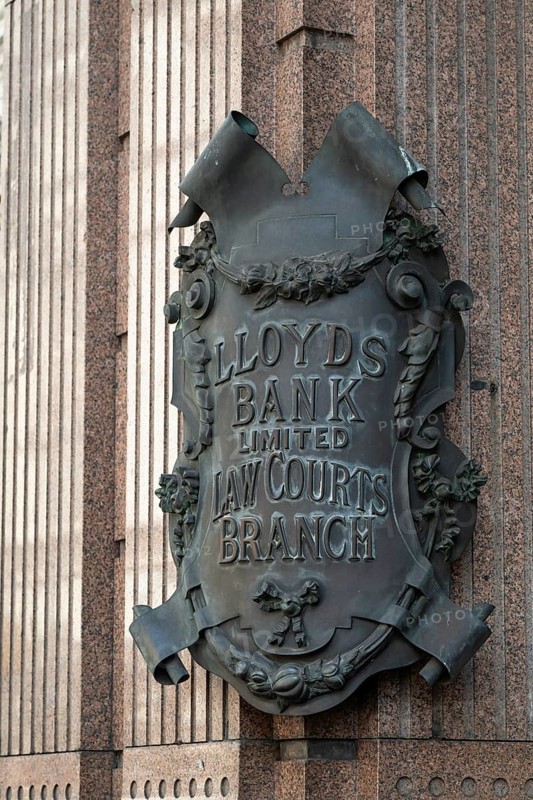 Lloyds Bank coat of arms like metal sign in decorative style on stone wall, London, England, Great Britain