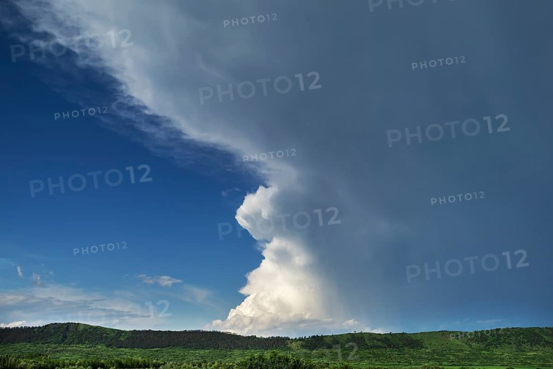Landscape with approaching rain front (Nimbostratus), southern Carpathian Arc, Romania