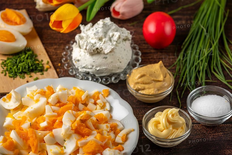 Ingredients for egg cream, such as cream cheese, sliced eggs and chives