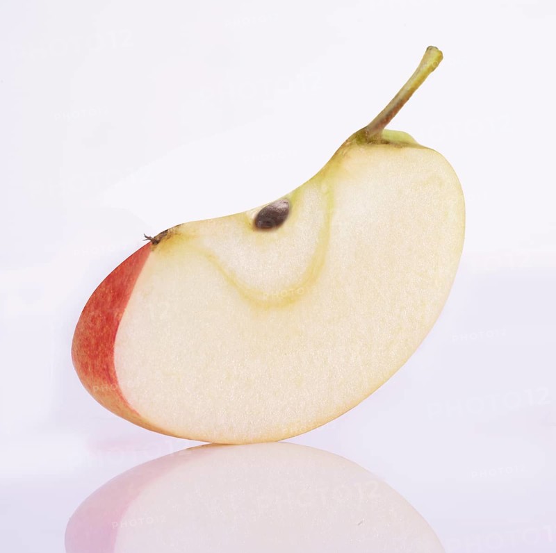 Apple cleft (Malus domestica) in front of a white background, studio shot