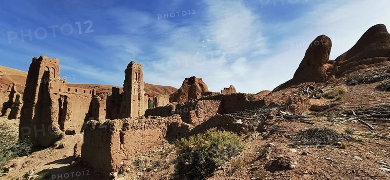 Ancient ruins of a past civilization under bright blue skies in desert-like surroundings, Morocco