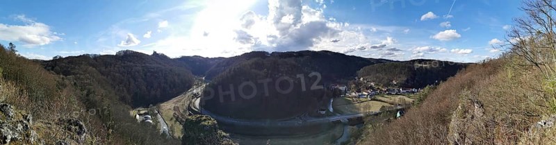 Panoramic view of a hilly landscape with river and village, Franconian Switzerland
