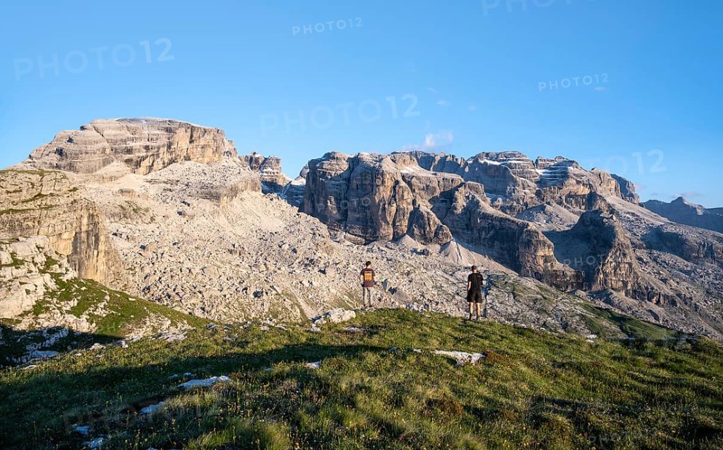 Hikers on the Grosté Plateau, mountain peaks of the Brenta Mountains, Brenta, Brenta-Adamello Natural Park, Trentino, Italy
