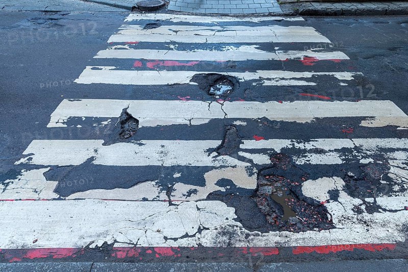 Dilapidated street and crosswalk, Lviv, Ukraine