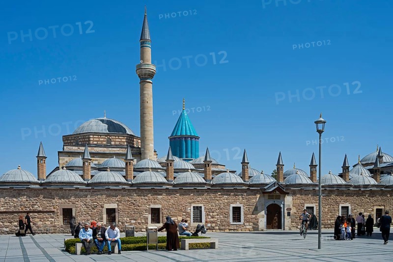 View of a large mosque with minaret and domes surrounded by people and blue sky, Mevlana Museum, Mevlana, landmark, mausoleum of Mevlânâ Jalal ad-Din Rumi, Konya, Central Anatolia, Turkey