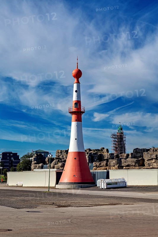 White-red lighthouse under cloudy sky on the coast, The City of Bremen