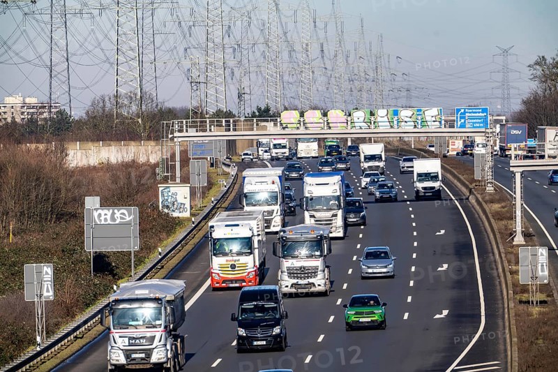 A57 motorway near Kaarst in the Rhein-Kreis Neuss, view towards Kaarst motorway junction, direction Cologne, heavy traffic, overhead line, high-voltage lines, along the motorway, North Rhine-Westphalia, Germany