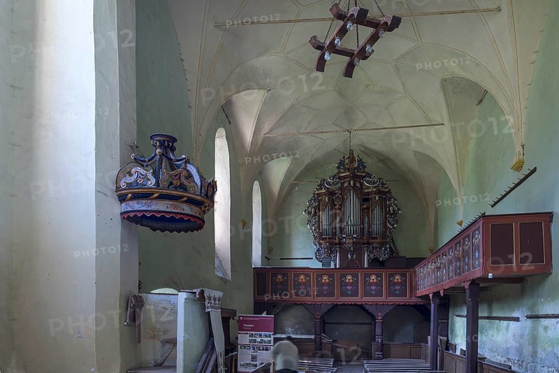 Interior with baroque organ of the abandoned 16th century Protestant fortified church, Tobsdorf, Romanian Dupus, —Transylvania, Romania
