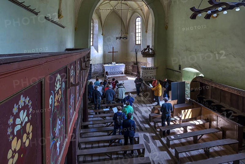 Improvised service in the abandoned church in Tobsdorf, Transylvania, Bulgaria