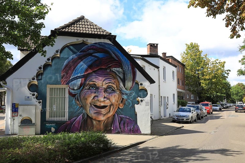 Graffiti portrait of an elderly woman from Bali. The work of art is part of the Kultur aus Tausch project. The aim of this initiative is to bring portraits of different cultures around the world to the streets of Oldenburg, Lower Saxony, Germany