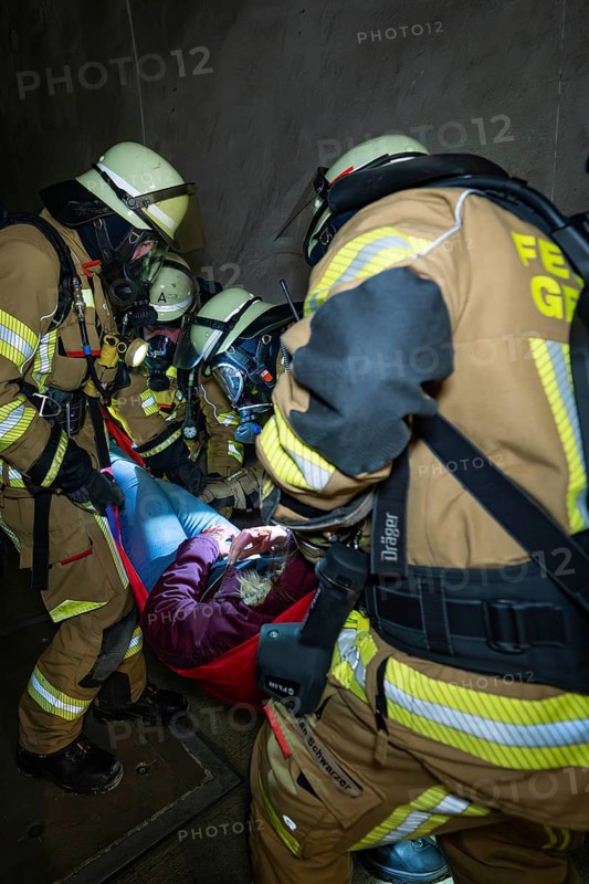 Firefighters free a person in a tunnel with a stretcher, fire brigade exercise on the Hermann Hesse railway, Ostelsheim, Germany