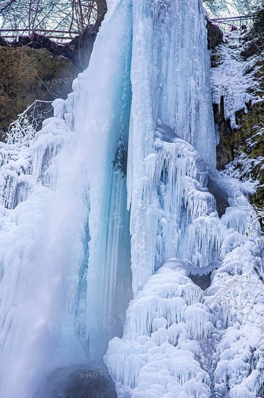 Urach waterfall full of bizarre ice formations frozen at winter temperatures, Bad Urach, Swabian Jura, Baden-Württemberg, Germany