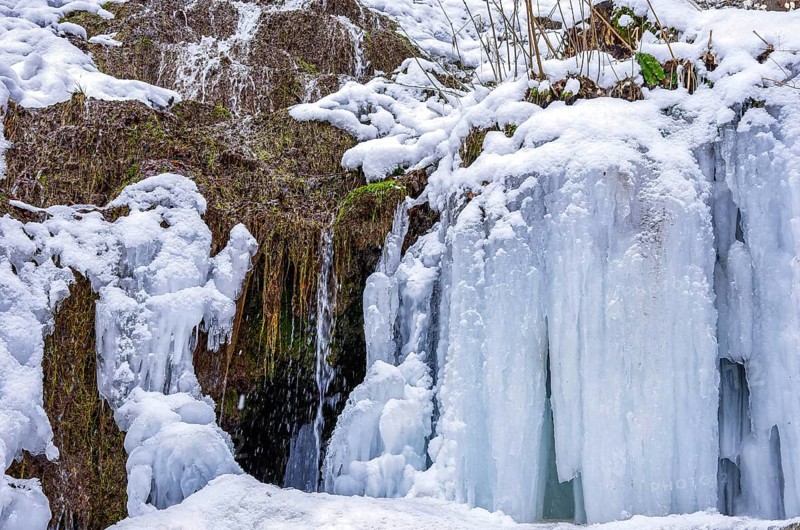 Urach waterfall full of bizarre ice formations frozen at winter temperatures, Bad Urach, Swabian Jura, Baden-Württemberg, Germany
