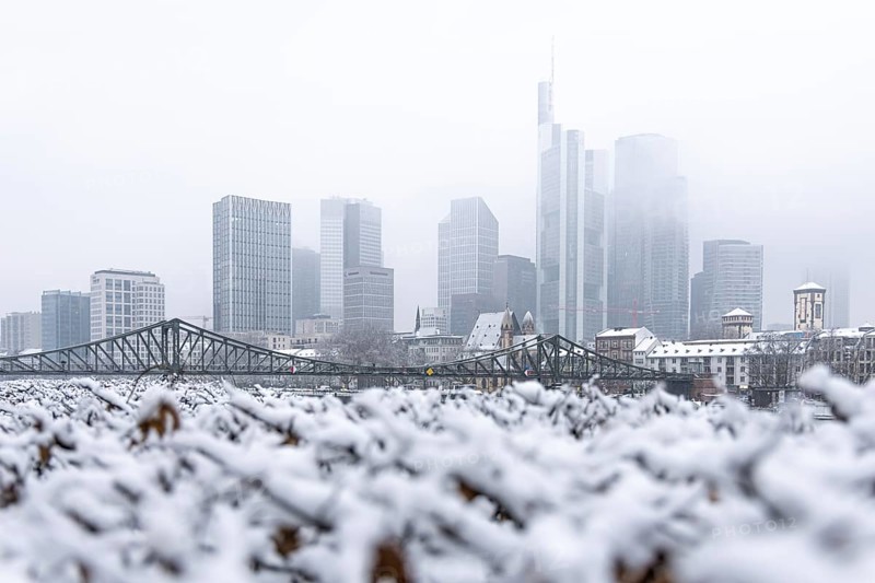 Clouds envelop Frankfurt's banking skyline. Heavy snowfalls have caused another onset of winter in the Main metropolis, Osthafen, Frankfurt am Main, Hesse, Germany