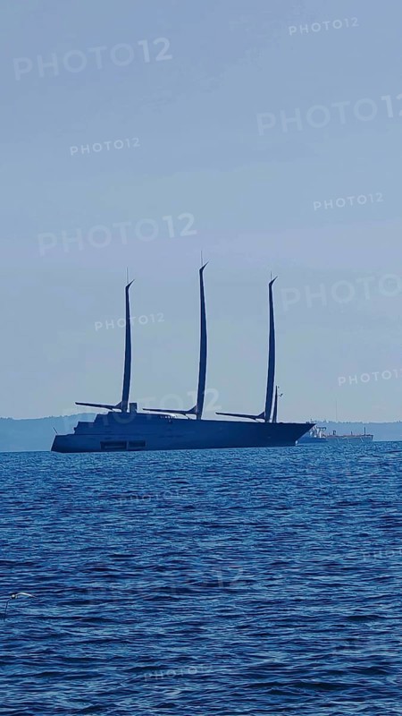 Large modern sailing ship Sailing yacht a, largest sailing yacht in the world, with three masts on the open sea on the horizon, Trieste, Italy
