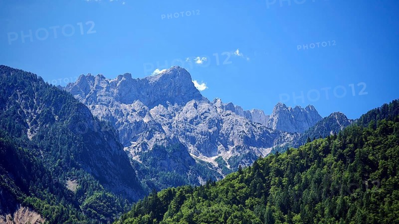 Mountain massif with rocky peaks and forest, Slovenia