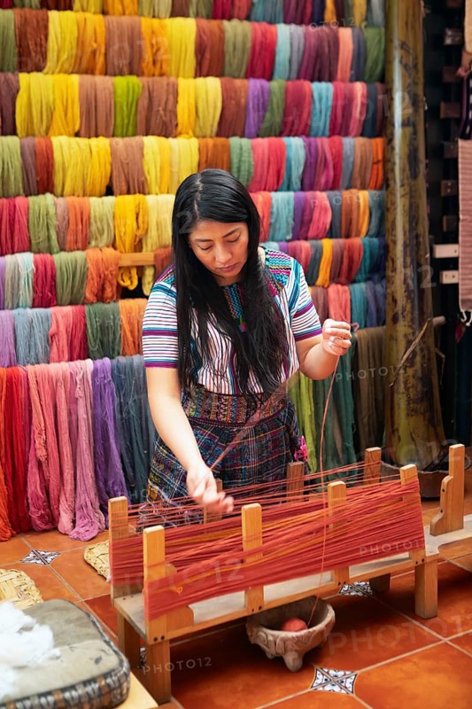 Maya woman, 42 years old, places cotton in a weaving frame, traditional craft in a woman's cooperative, San Juan la Laguna, Atitlán, Sololá Department, Guatemala