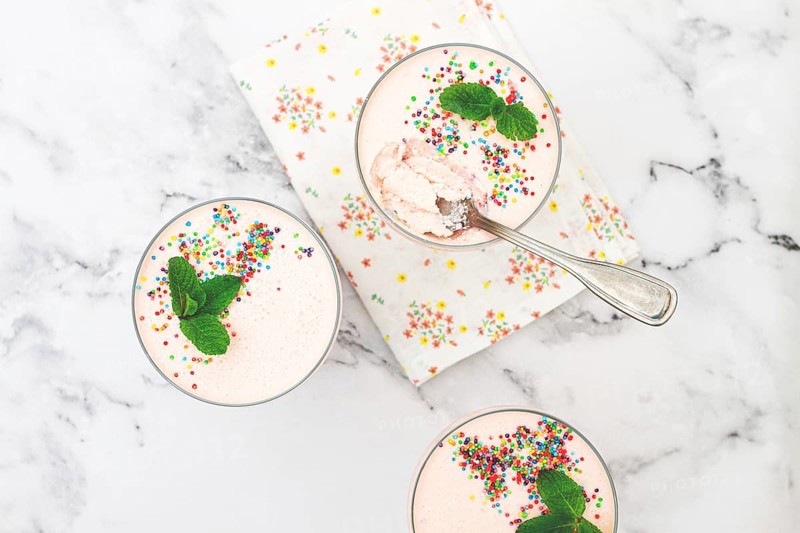 Fruit mousse, made from jelly and cottage cheese, in glasses, decorated with sprinkles and mint, homemade