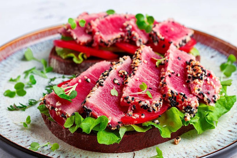 Sandwiches with fried tuna fillet in sesame seeds, breakfast, top view, homemade