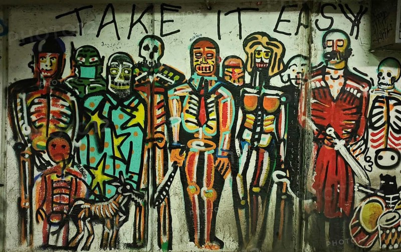 Colourful skeleton-style graffiti artwork with the inscription 'Take It Easy, 'Tbilisi, Georgia