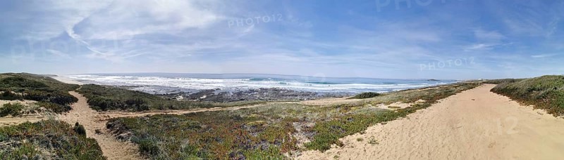 Panoramic view of a sandy beach and sea, hiking on the fishing trail, Southwest Alentejo nature park Park and Vicentina Coast, Portugal