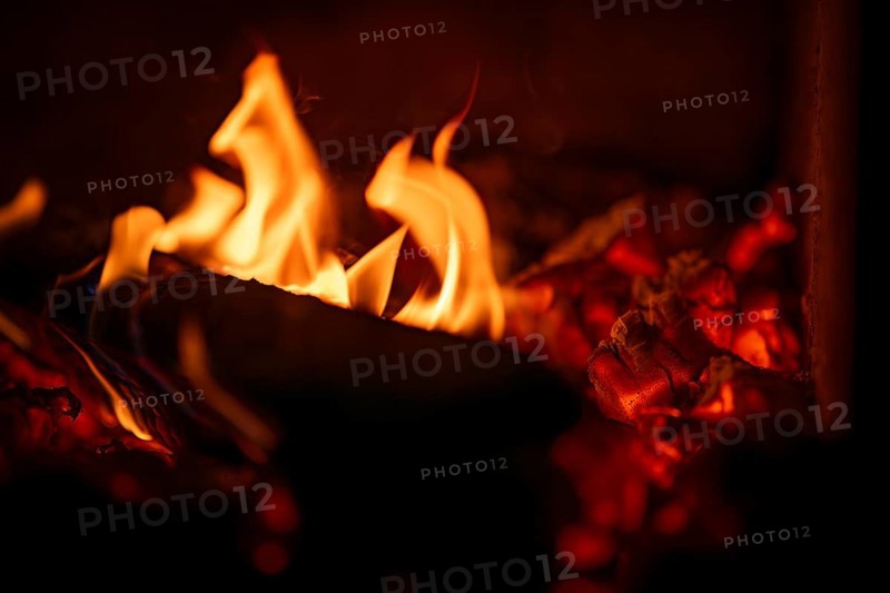 Burning wood, log, embers, fire in a fireplace
