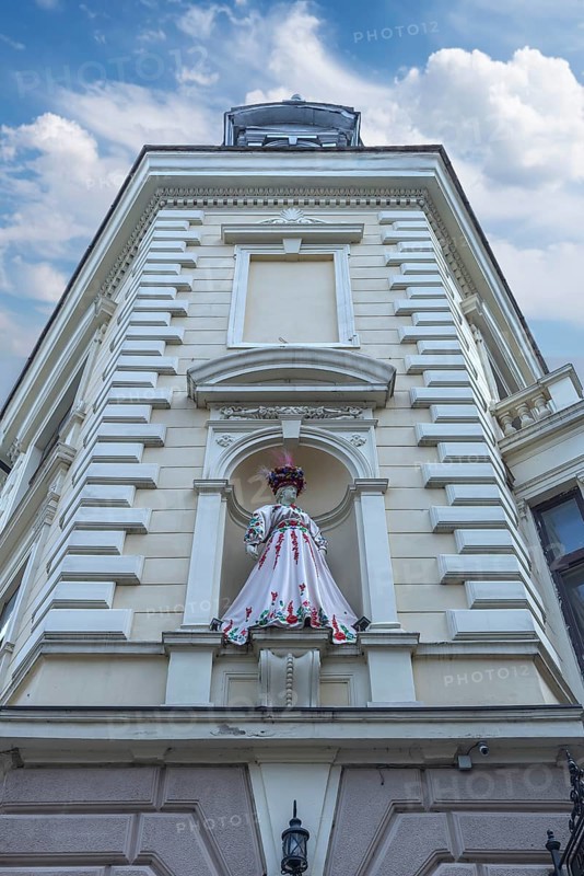 Mannequin in Ukrainian traditional costume in a niche at a 19th-century house, Czernowicz, Ukraine