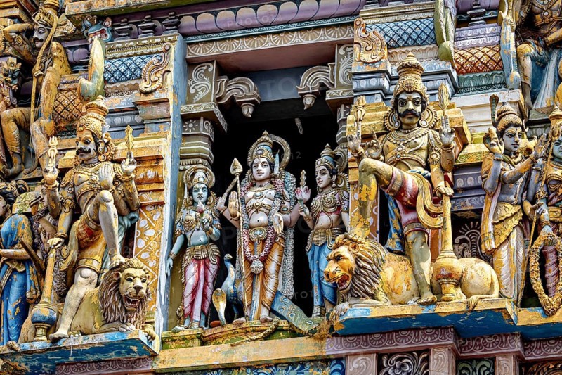 Artfully decorated sculptures of deities and lions at a temple