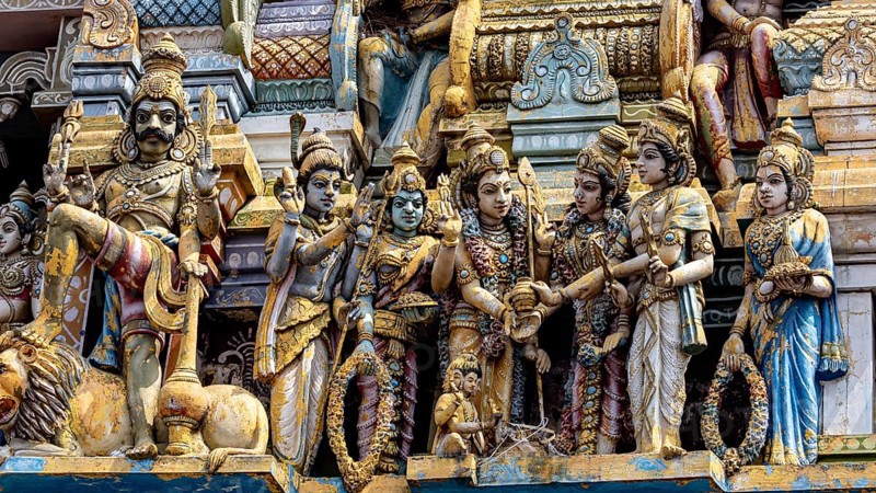 Detailed Hindu sculptures on a temple, richly decorated
